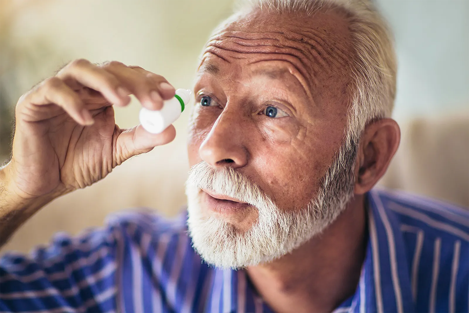 an old man using medicine